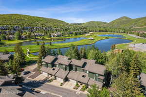 Aerial perspective of suburban area with a water and mountain view
