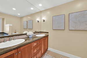 Primary bathroom with jetted tub and walk-in shower.
