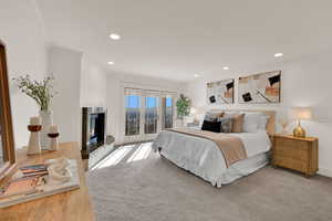 Primary bedroom with private balcony.