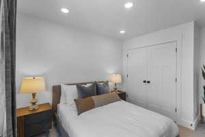Carpeted bedroom featuring a closet and recessed lighting