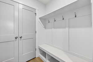 Mudroom with light wood finished floors