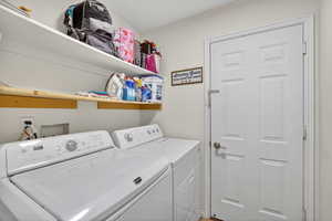 Laundry area with washer and clothes dryer