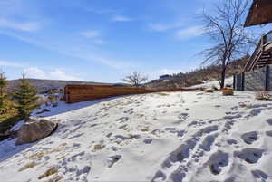 View of yard covered in snow