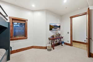 Carpeted bedroom featuring baseboards and recessed lighting