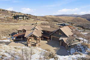 Snowy aerial view featuring a mountain view