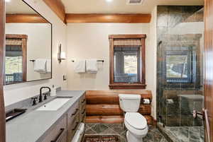 Bathroom featuring vanity and a stall shower