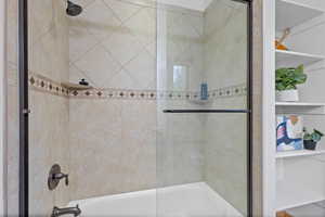 Bedroom #2 – Full Bathroom, Shower/Tub. Full bath with shower / bath combination with glass door