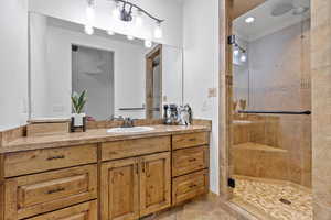 Bedroom #3 – En-Suite Full Bathroom. Bathroom with a stall shower, vanity, light tile patterned flooring, and recessed lighting