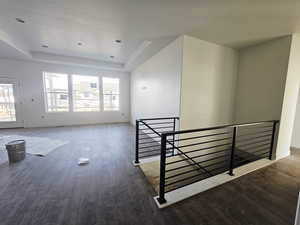 Interior space featuring wood finished floors and a raised ceiling