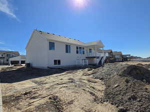 Back of property featuring a residential view and a deck