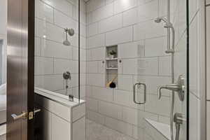 Bathroom featuring a shower stall