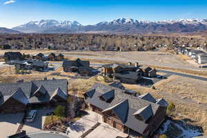 Aerial view of residential area featuring a mountain backdrop