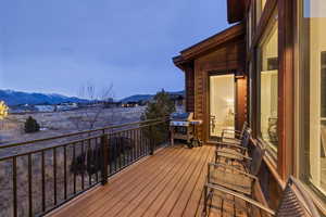 Deck with a grill and a mountain view