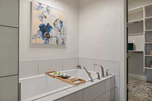 Full bathroom featuring a garden tub