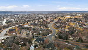 Aerial view of property's location featuring nearby suburban area