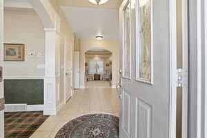 Tiled foyer entrance with arched walkways