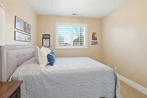 Bedroom with carpet and baseboards