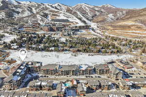 Snowy aerial view with a mountain view