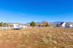 View of yard featuring a mountain view and a view of countryside