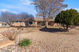View of front of home featuring stucco siding and a tiled roof