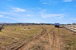 View of yard featuring a rural view and a mountain view