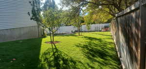 View of fenced backyard