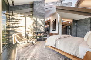 Bedroom with a large fireplace