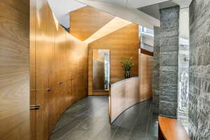 Reception featuring wood walls