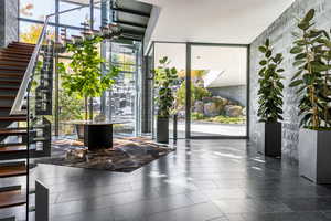 Lobby featuring stairs and expansive windows