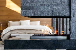 Bedroom featuring wood walls