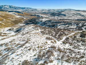 Snowy aerial view with a mountain view