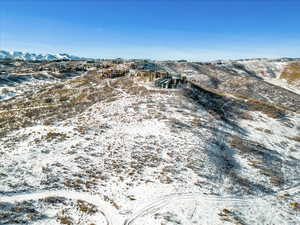 Snowy aerial view featuring a mountain view
