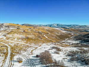 Snowy aerial view featuring a mountain view