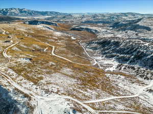 Snowy aerial view with a mountain view