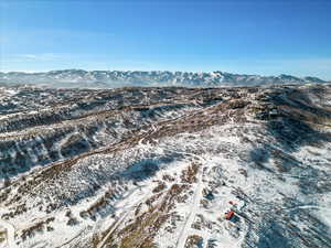 Snowy aerial view with a mountain view