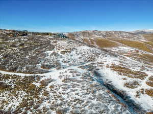 Snowy aerial view with a mountain view
