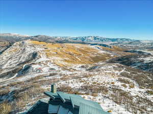Snowy aerial view with a mountain view