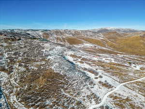 Snowy aerial view with a mountain view