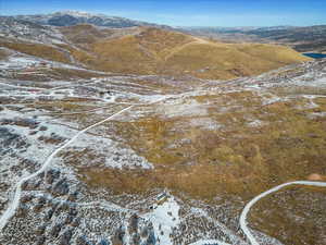 Snowy aerial view featuring a mountain view