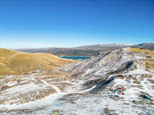 View of mountain backdrop with a large body of water