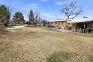 View of yard with a patio area and a hot tub