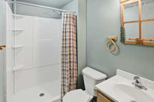 Bathroom with a shower stall and vanity
