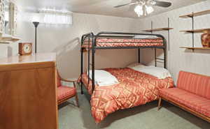 Bedroom with light colored carpet and ceiling fan