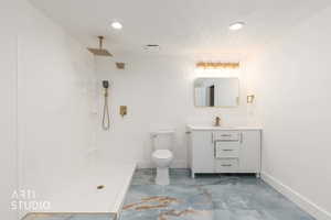 Full bath featuring vanity, a walk in shower, and recessed lighting