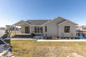 Back of house with stucco siding, a patio, and roof with shingles