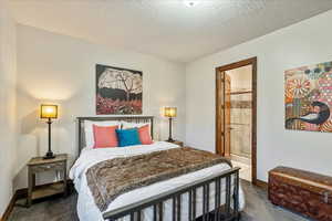 Main-level bedroom suite featuring a private ensuite with a full, beautifully appointed bathroom.
