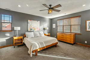 This is the home’s luxurious primary suite, a private sanctuary designed for comfort and refined living.