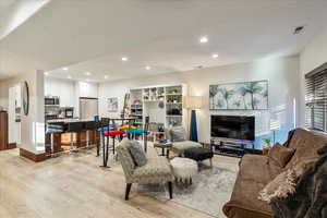 Down living space with view from entrance side of basement.