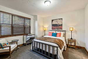 Main-level bedroom suite featuring a private ensuite with a full, beautifully appointed bathroom.