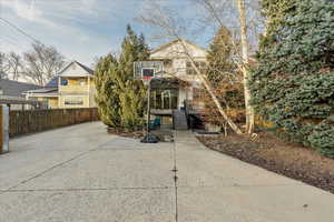 Large driveway behind a secure power gate, offering abundant off-street parking with added privacy and convenience for guests, recreation, and daily living.